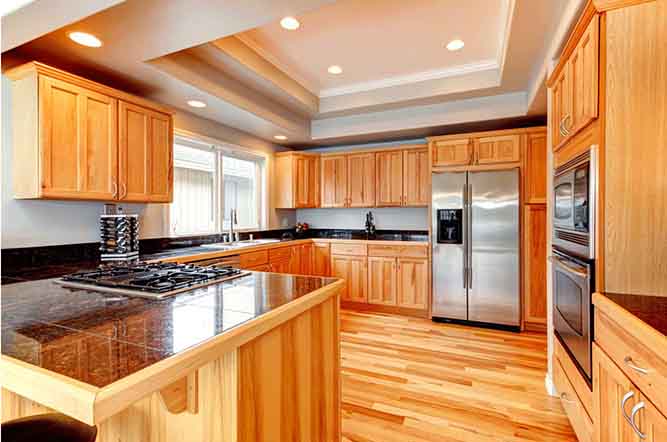 large kitchen with natural finish cabinets