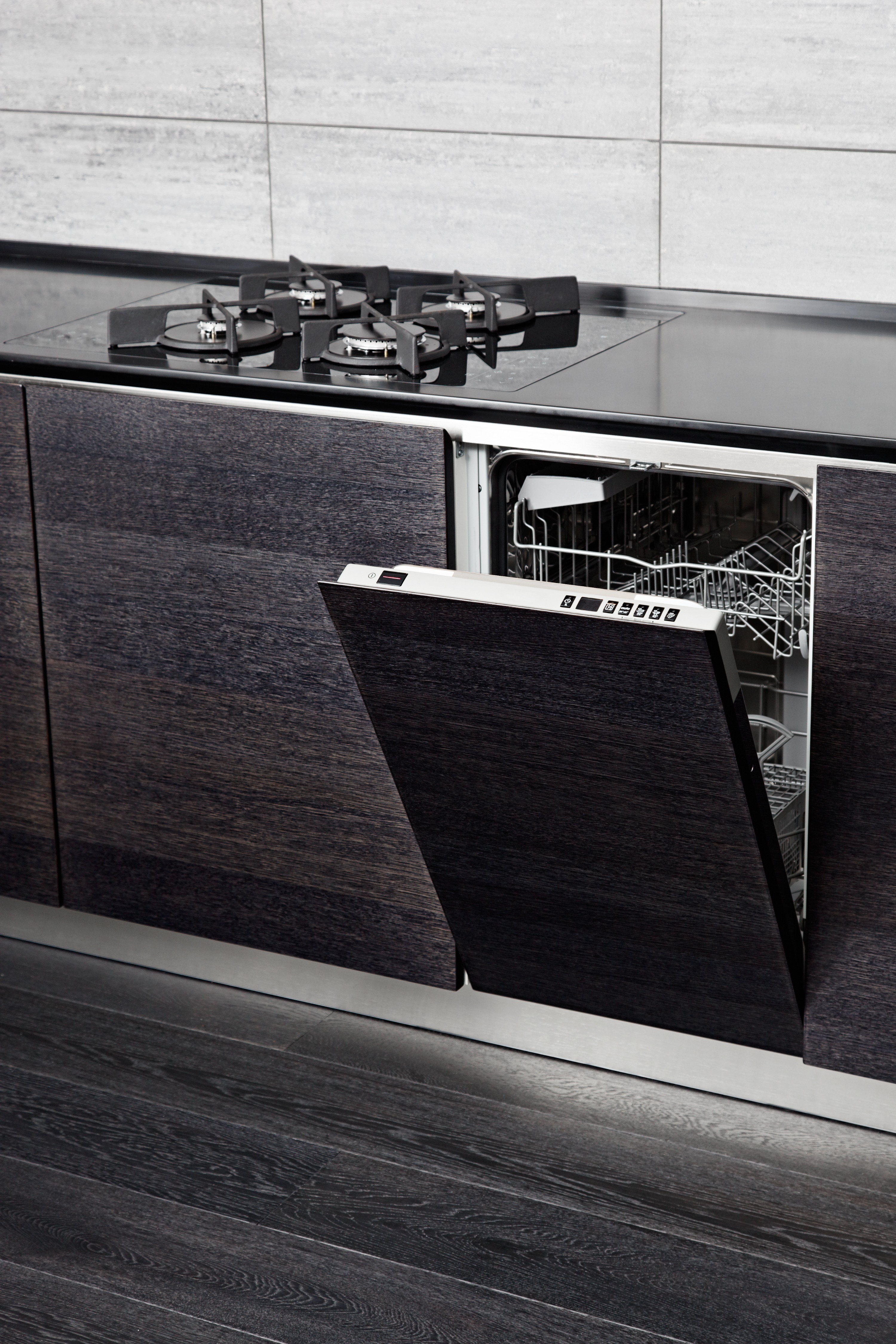 A panel ready dishwasher in a slab style kitchen.