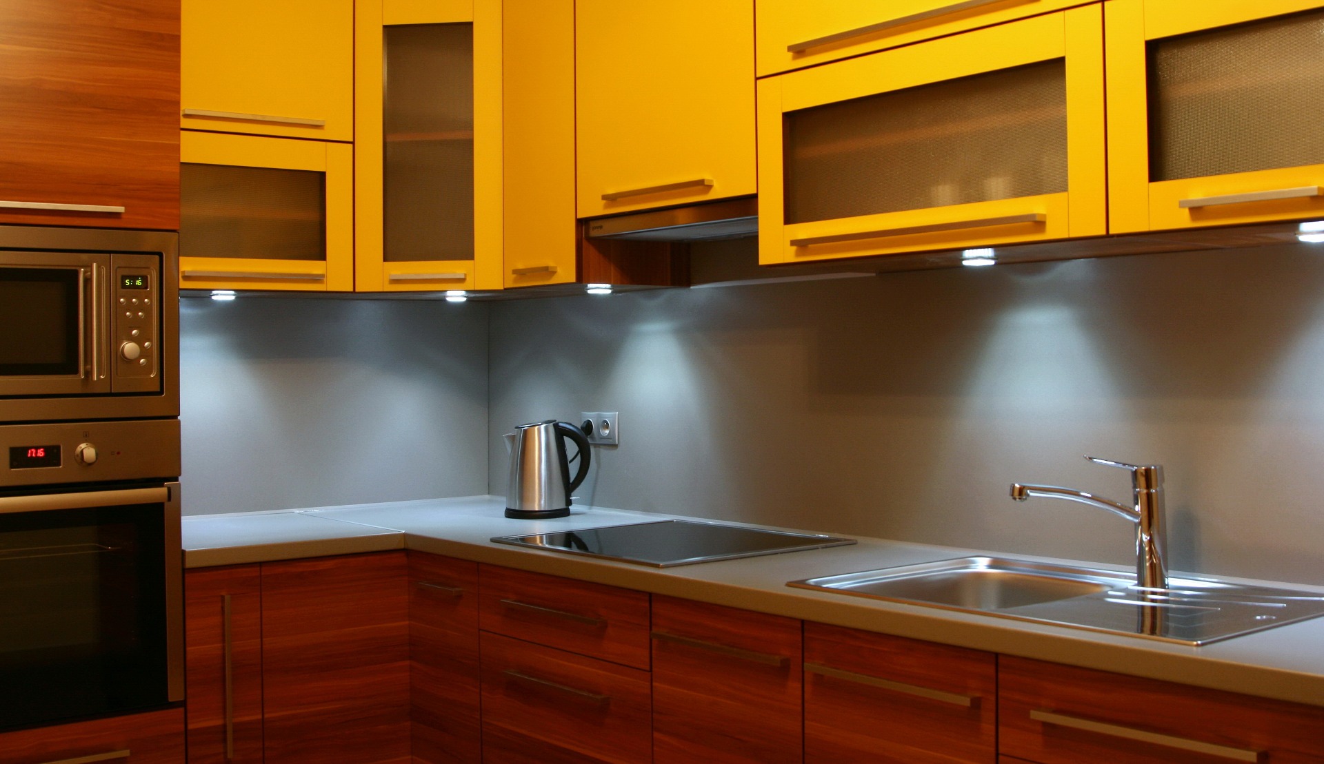 glass cabinet doors in low lit kitchen 