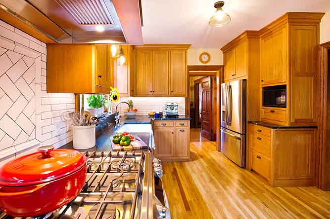 kitchen with natural finish oak cabinets