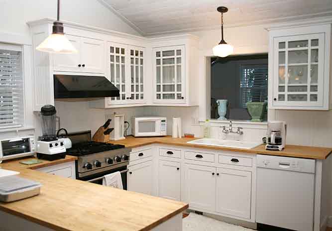 white kitchen with glass panels 